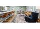 Open-concept living space with a kitchen island, dining area, and cozy seating arrangement at 14428 W Ellsworth Pl, Golden, CO 80401