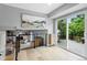Bright loft space with a sliding glass door to a deck, overlooking the living area at 14428 W Ellsworth Pl, Golden, CO 80401