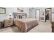 Spacious main bedroom featuring a cozy bed, bedside tables, and an ensuite bathroom for a luxurious retreat at 14428 W Ellsworth Pl, Golden, CO 80401
