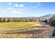 Beautiful backyard with a view of a golf course and the surrounding valley and mountains at 17076 W 71St Pl, Arvada, CO 80007