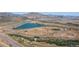 Scenic aerial shot showcases a lake, mountains, highway, and surrounding landscape at 4286 S Eldridge St # 202, Morrison, CO 80465