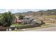 A spacious backyard features a deck, play set, and a partially fenced yard at 4286 S Eldridge St # 202, Morrison, CO 80465