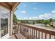 View from the balcony showcases tree lined streets and a clear blue sky at 4286 S Eldridge St # 202, Morrison, CO 80465
