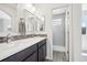 Modern bathroom features dual sinks, white countertops, and a glass-enclosed shower at 4286 S Eldridge St # 202, Morrison, CO 80465