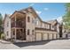 Charming townhome featuring private entrances, attached garages, stone accents, and neutral color palette at 4286 S Eldridge St # 202, Morrison, CO 80465
