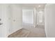 Bright hallway with access to multiple rooms with neutral paint and carpet at 4286 S Eldridge St # 202, Morrison, CO 80465