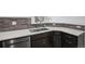 Kitchen with stainless steel appliances, dark wood cabinets, and white countertops at 4286 S Eldridge St # 202, Morrison, CO 80465