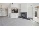 Open-concept living room features fireplace, built-in shelving and access to a private balcony at 4286 S Eldridge St # 202, Morrison, CO 80465