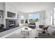 Bright living room features a fireplace, large windows with neighborhood views, and modern furniture at 4286 S Eldridge St # 202, Morrison, CO 80465