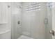 Contemporary glass enclosed shower features a tiled interior and a window with glass blocks at 4286 S Eldridge St # 202, Morrison, CO 80465