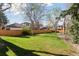 Expansive backyard with lush green grass and a privacy fence, perfect for outdoor activities and relaxation at 6358 S Jackson St, Centennial, CO 80121