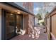 Backyard deck with wood fence, brick siding, and sliding glass doors at 6358 S Jackson St, Centennial, CO 80121