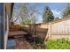 Backyard with patio, wood fence, and small plants at 6358 S Jackson St, Centennial, CO 80121