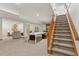 Finished basement with open layout, carpeted flooring, and staircase at 6358 S Jackson St, Centennial, CO 80121