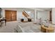 Finished basement with table tennis table, sitting area, and access to storage at 6358 S Jackson St, Centennial, CO 80121