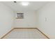 Finished basement featuring a window, tile flooring, and freshly painted walls at 6358 S Jackson St, Centennial, CO 80121