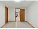 Finished basement area with tiled floor and open doorway at 6358 S Jackson St, Centennial, CO 80121
