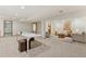 Versatile basement space with carpet, table tennis setup, and cozy sitting area at 6358 S Jackson St, Centennial, CO 80121