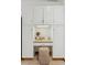 Charming built-in desk nook with granite countertop and extra cabinet space in kitchen at 6358 S Jackson St, Centennial, CO 80121