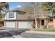 Charming two-story home with a three-car garage, brick accents, and a well-maintained front yard at 6358 S Jackson St, Centennial, CO 80121