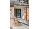 Inviting front door with brick columns, modern lighting, and clear property number at 6358 S Jackson St, Centennial, CO 80121