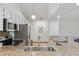 Well-lit kitchen features stainless steel appliances, granite countertops, and ample cabinet space at 6358 S Jackson St, Centennial, CO 80121