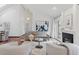 Bright living room with high ceilings, fireplace, and sliding doors to the outdoors at 6358 S Jackson St, Centennial, CO 80121