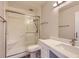 Renovated bathroom featuring a sleek glass-enclosed shower and modern vanity at 720 S Clinton St # 2D, Denver, CO 80247