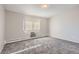 Light and airy bedroom with carpeted floors, a large window and neutral paint at 720 S Clinton St # 2D, Denver, CO 80247