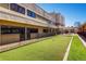 Well-maintained bocce ball court with a fitness center in the background at 720 S Clinton St # 2D, Denver, CO 80247