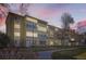 Charming exterior view of the building, showcasing its unique architectural details and well-maintained grounds at 720 S Clinton St # 2D, Denver, CO 80247