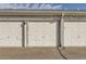 Garages with white doors and house numbers at 720 S Clinton St # 2D, Denver, CO 80247