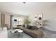 Bright living room with modern furniture and decor, flowing out to a balcony with a view at 720 S Clinton St # 2D, Denver, CO 80247