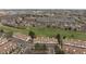 An aerial view of townhomes in a community with green spaces and a golf course nearby at 3026 W Prentice Ave # H, Littleton, CO 80123