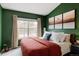 Comfortable bedroom boasts generous natural light and soft carpet at 3026 W Prentice Ave # H, Littleton, CO 80123