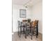 Cozy dining area features a modern track light, stylish table set, and attractive wall art at 3026 W Prentice Ave # H, Littleton, CO 80123