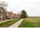 Exterior view of townhomes with landscaped green space at 3026 W Prentice Ave # H, Littleton, CO 80123