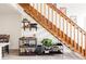 Staircase featuring a decorative bar cart, shelving and easy access to living area at 3026 W Prentice Ave # H, Littleton, CO 80123
