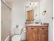 Bathroom featuring wood vanity, a shower-over-tub and neutral color scheme at 30671 Bearcat Trl, Conifer, CO 80433