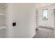 Walk in closet featuring multiple shelves and carpeted floors at 30671 Bearcat Trl, Conifer, CO 80433