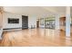 Spacious living room featuring hardwood floors, modern fireplace, and scenic views at 30671 Bearcat Trl, Conifer, CO 80433