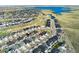 Beautiful aerial view of a home in a picturesque neighborhood, complemented by a lake and green spaces at 7051 S White Crow Way, Aurora, CO 80016