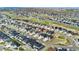 Expansive aerial shot showcases a home nestled in a vibrant community with lush green spaces and meticulously manicured lawns at 7051 S White Crow Way, Aurora, CO 80016