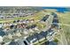 Stunning aerial view of a home in a picturesque neighborhood, complemented by lush green spaces and well-maintained streets at 7051 S White Crow Way, Aurora, CO 80016
