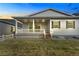 Another shot of the back of the home, showcasing the back porch at 7051 S White Crow Way, Aurora, CO 80016