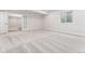 Finished basement area with a glass door and view into a separate room at 7051 S White Crow Way, Aurora, CO 80016