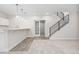 Finished basement area with bar, pendant lighting, modern staircase, and open space for entertaining at 7051 S White Crow Way, Aurora, CO 80016