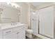 Modern bathroom with white vanity, frameless glass shower, and neutral wall colors at 7051 S White Crow Way, Aurora, CO 80016