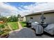 A backyard with a brick walkway and an outdoor seating area at 334 S 7Th Ave, Brighton, CO 80601