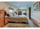 A well-lit bedroom with carpeted floors, warm colors, and ample space at 334 S 7Th Ave, Brighton, CO 80601